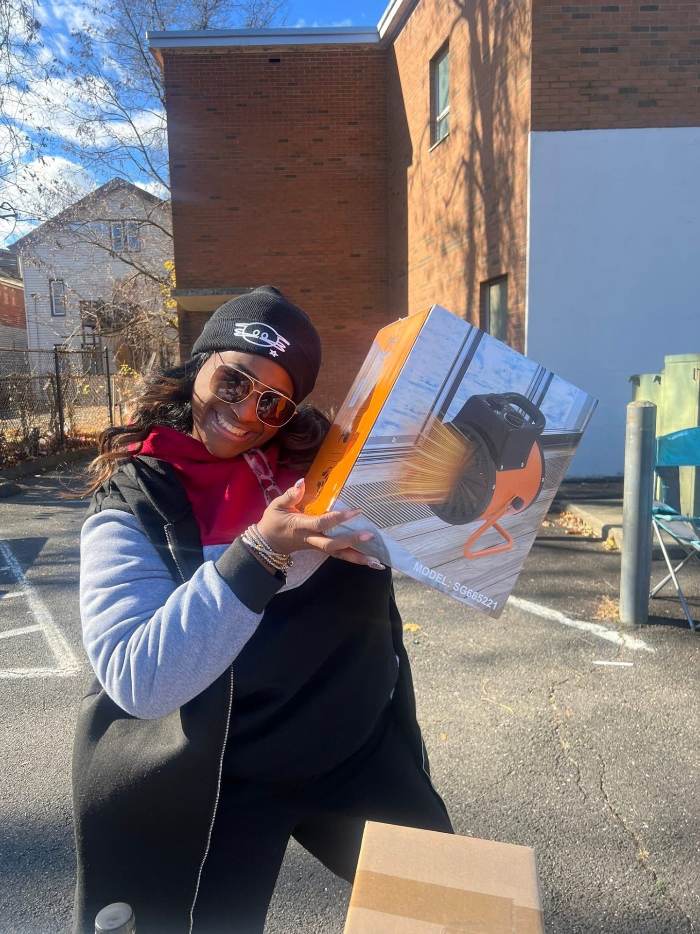 Family receiving a heater during winter relief outreach
